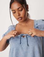 ASOS DESIGN Curve denim mini dress with puff sleeve and tie detail in light wash