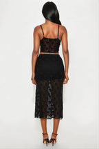 Black lace two-piece outfit on a white background