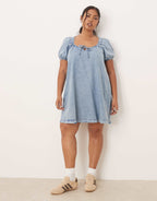 ASOS DESIGN Curve denim mini dress with puff sleeve and tie detail in light wash