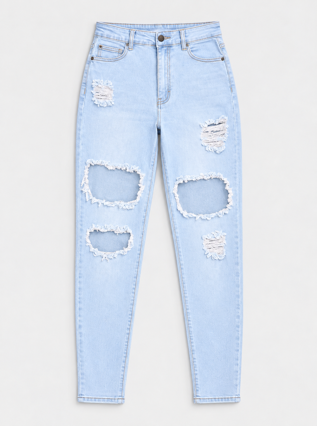 Flat lay of Everyday Ripped Skinny Jeans - Light Blue Wash on a light grey background