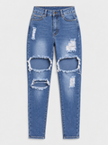 Flat lay of Everyday Ripped Skinny Jeans - Medium Wash on a light grey background