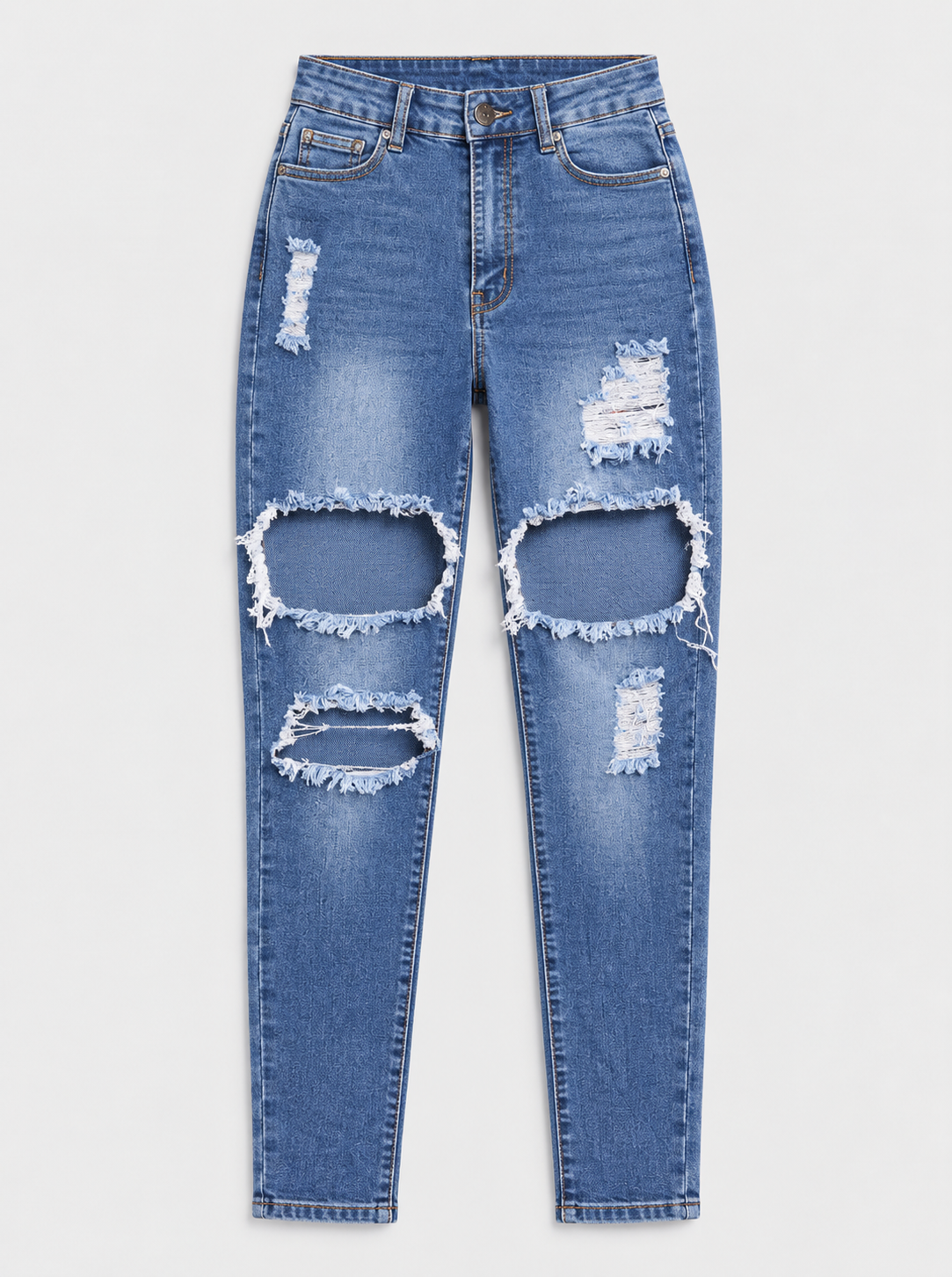 Flat lay of Everyday Ripped Skinny Jeans - Medium Wash on a light grey background