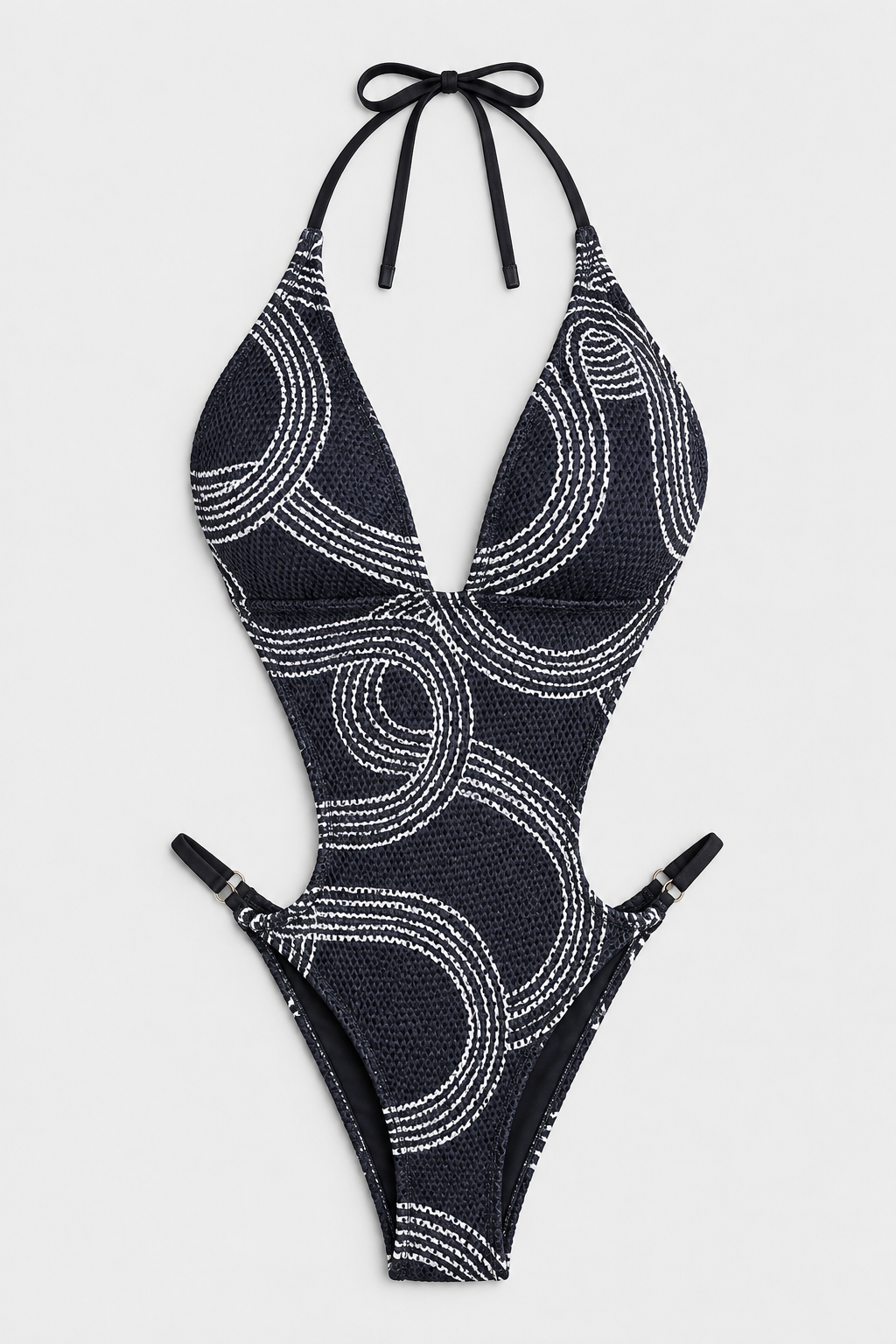 Flat lay of Halter Fishnet Cutout Swimsuit - Black and White on a light grey background