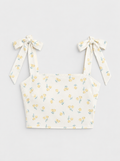 Flat lay of Shoulder Tie Smocked Cropped Top - Yellow Combo on a light grey background