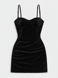 Flat lay of Sweetheart Strappy Velvet Mini Dress - Black on a light grey background